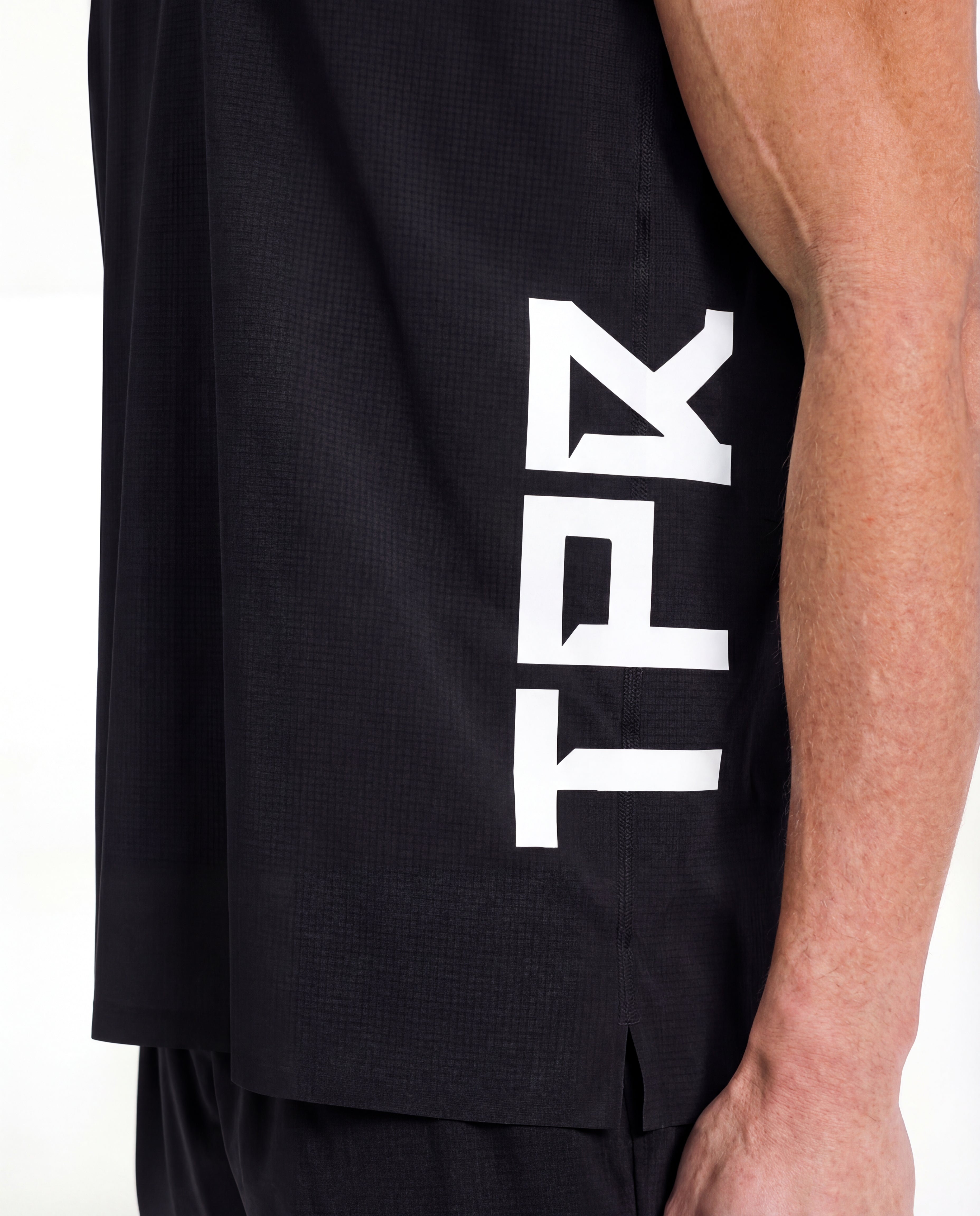 TPR Performance Singlet by Taper — close-up fabric detail