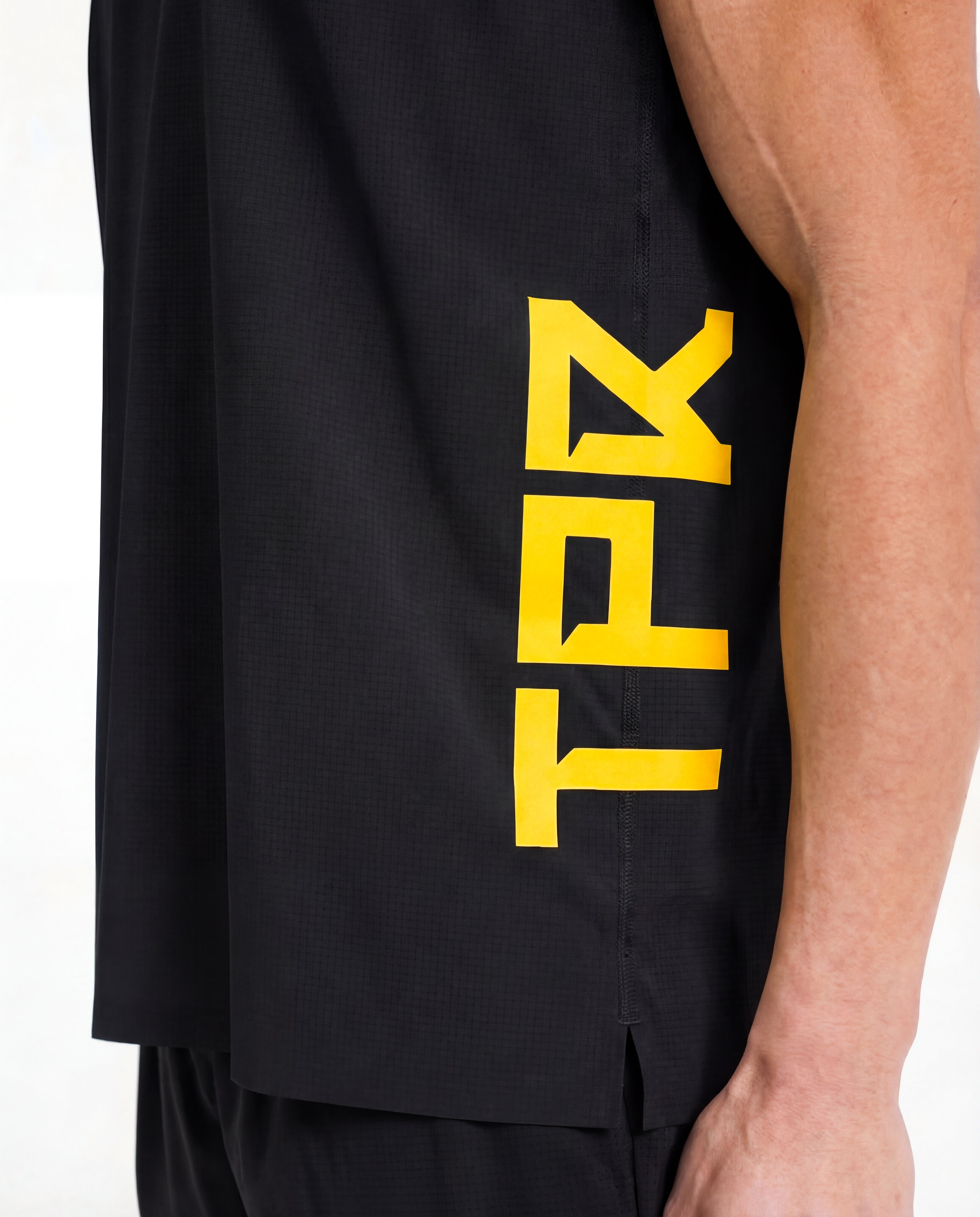 TPR Performance Singlet by Taper — close-up fabric detail