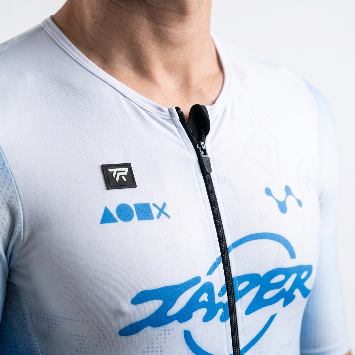 Taper Aerosuit collar, front zip, TR badge and chest print
