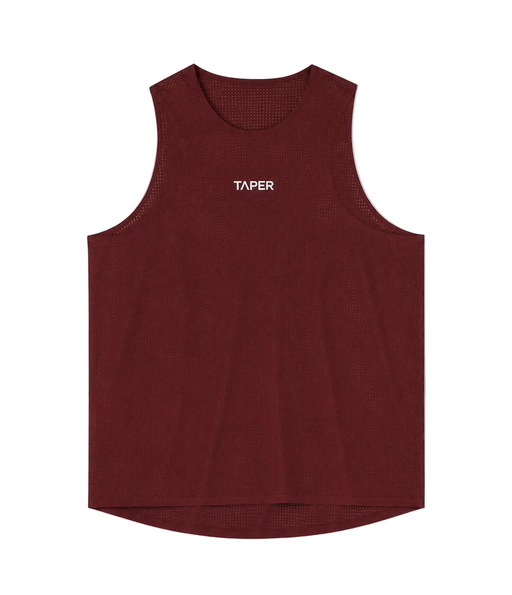 Taper Singlet by Taper in Burgundy — perforated running singlet, front